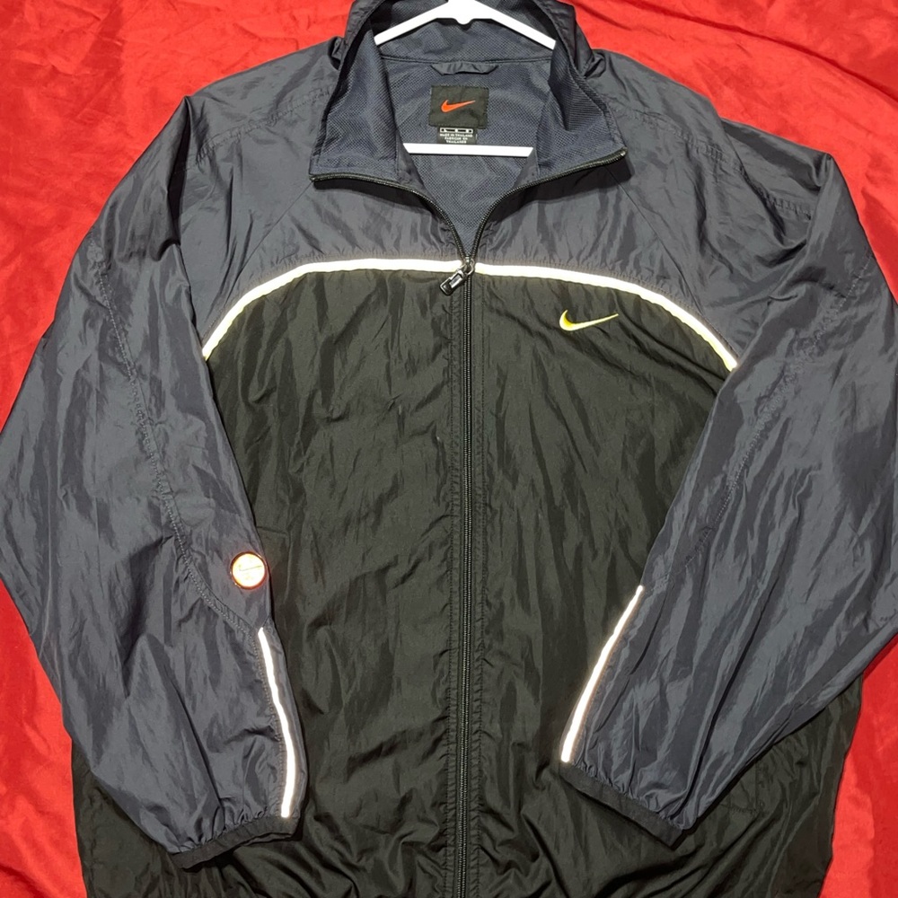 NIKE REFLECTIVE WINDBREAKER